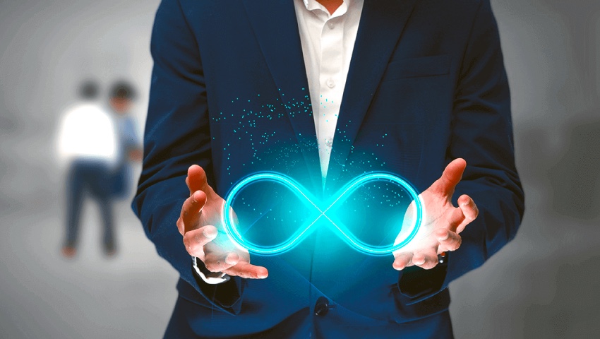 man with hologram of devops in his hands