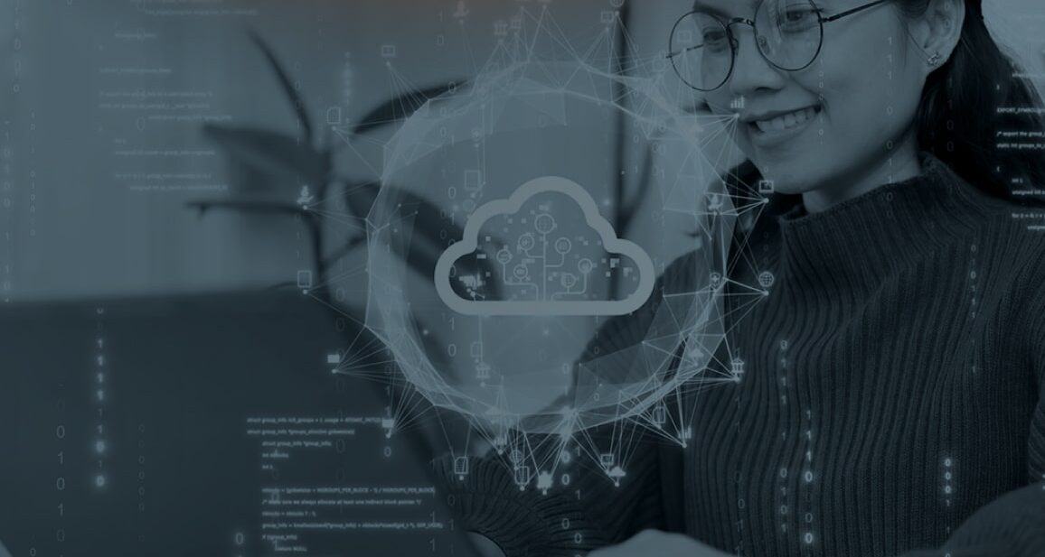 Woman working on a computer with a cloud symbol overlayed on it