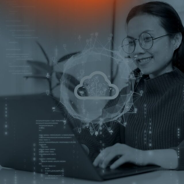 Woman working on a computer with a cloud symbol overlayed on it