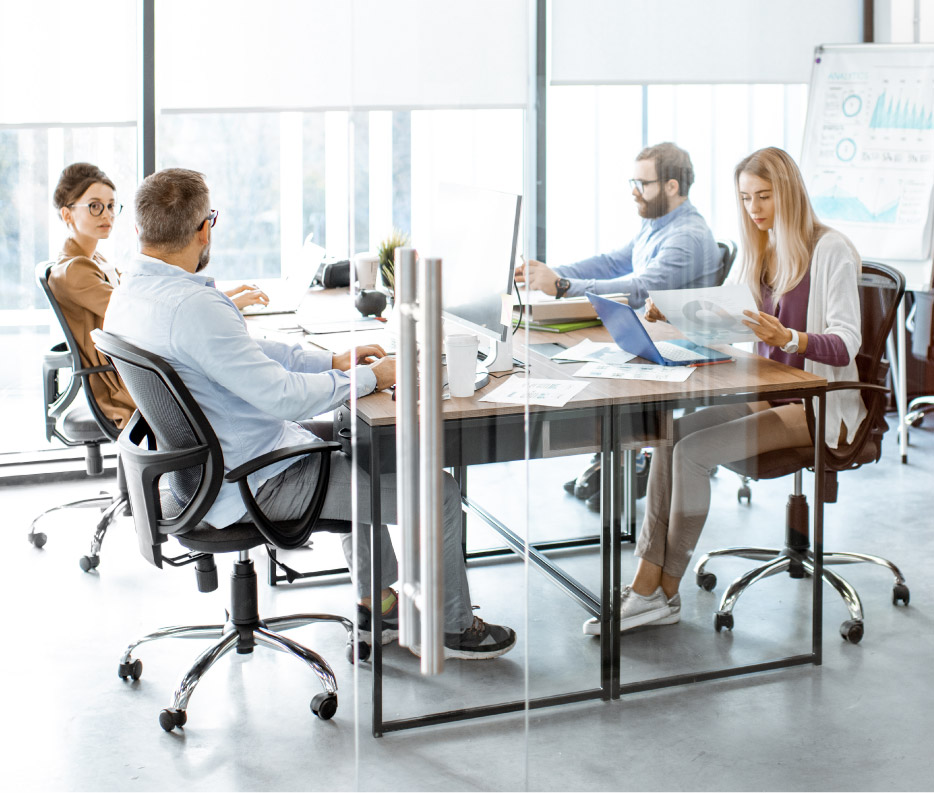 Nearshore staff professionals talking and working at the office