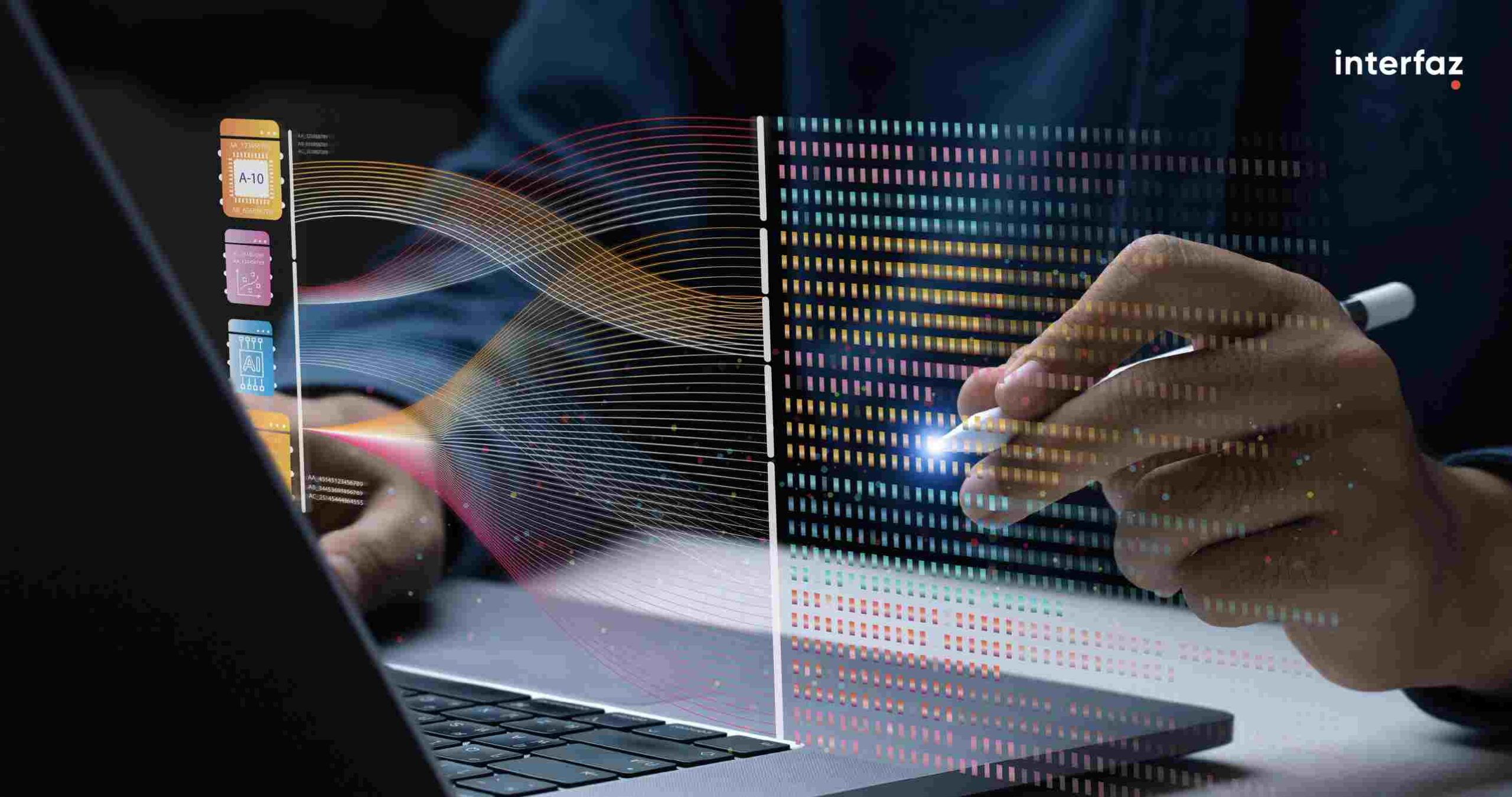 Man working on a laptop interacting with circuit holograms