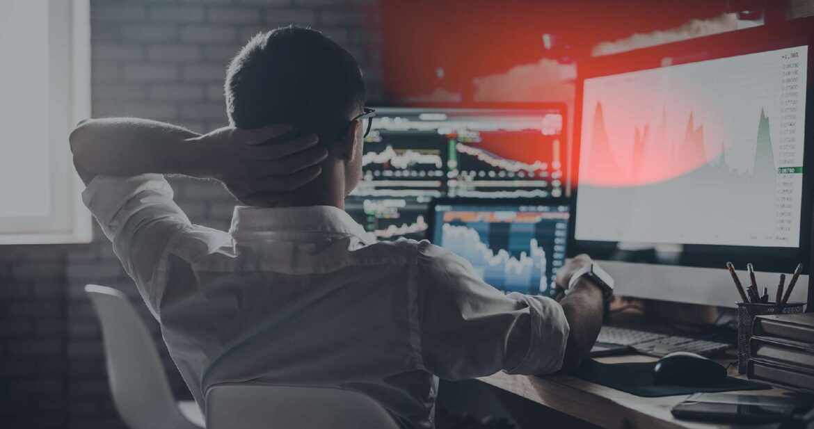 Man in front of a computer worried about the results of a computer test
