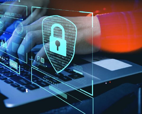 Image of a person working on software development security on a computer