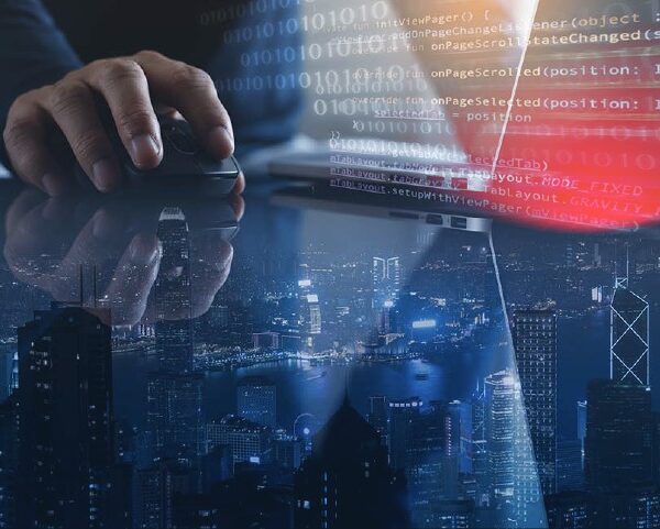 Double exposure of man using laptop and mobile phone and smart city with internet network