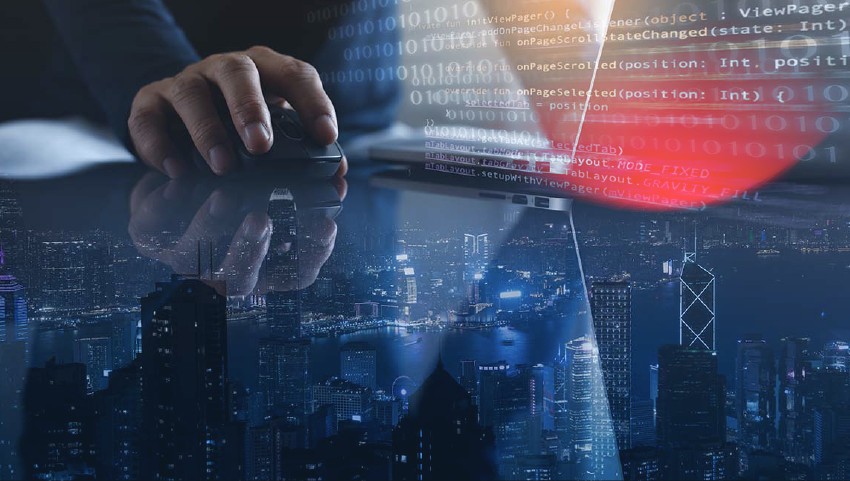 Double exposure of man using laptop and mobile phone and smart city with internet network