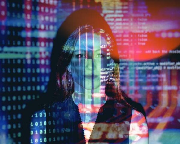 Woman on a technological background with an overlay of a programming code