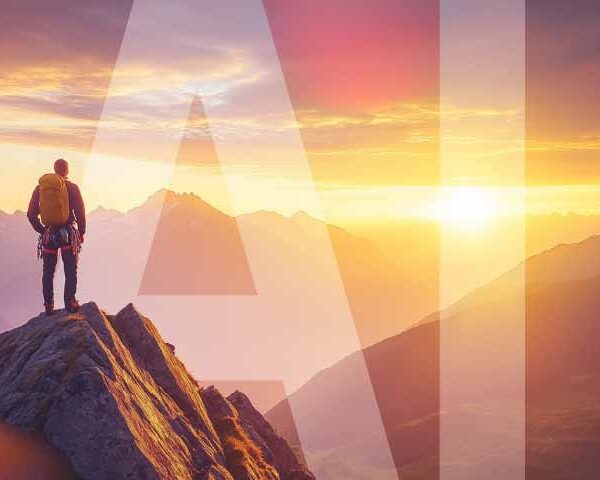 Business leader in the top of a mountain looking to the horizon with AI credit