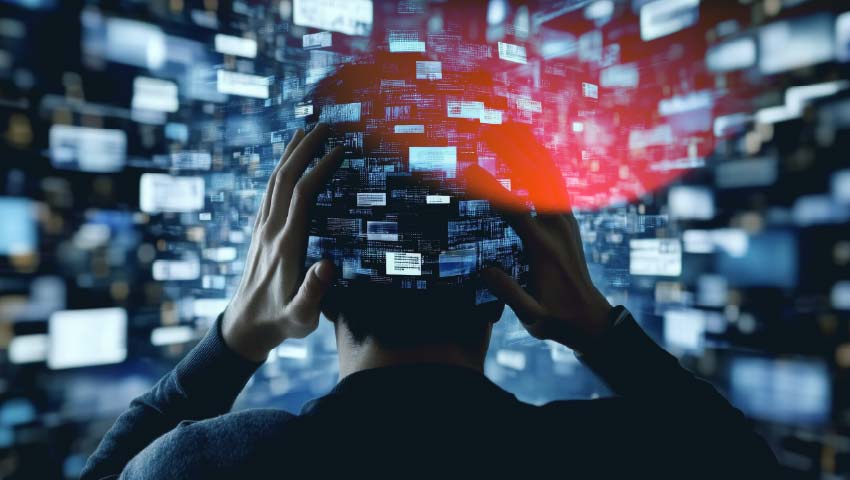 Stressed person in front of multiple screens